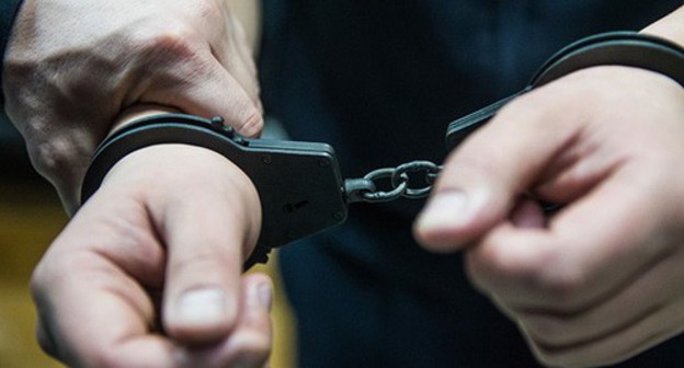 Handcuffs. Photo courtesy of Elena Sineok, Yuga.ru Handcuffs. Photo courtesy of Elena Sineok, Yuga.ru