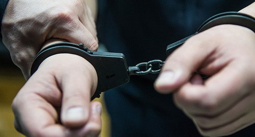 Handcuffs. Photo courtesy of Elena Sineok, Yuga.ru Handcuffs. Photo courtesy of Elena Sineok, Yuga.ru