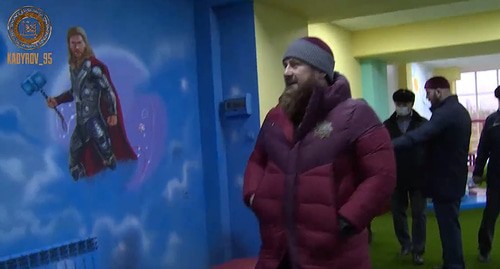 Ramzan Kadyrov near the images of characters from US movies and Marvel comics on the walls of the children's centre in Kurchaloi. Screenshot of Ramzan Kadyrov's post on the VKontakte https://vk.com/ramzan?w=wall279938622_543529&z=video279938622_456243691%2F521a68267418560268%2Fpl_post_279938622_543529 Ramzan Kadyrov near the images of characters from US movies and Marvel comics on the walls of the children's centre in Kurchaloi. Screenshot of Ramzan Kadyrov's post on the VKontakte https://vk.com/ramzan?w=wall279938622_543529&z=video279938622_456243691%2F521a68267418560268%2Fpl_post_279938622_543529