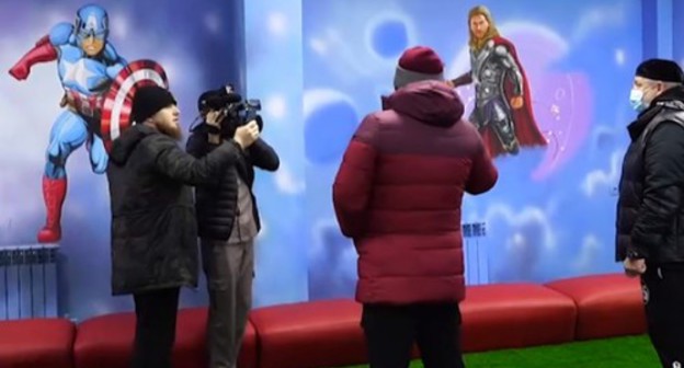 Ramzan Kadyrov near the images of characters from US movies and Marvel comics on the walls of the children's centre in Kurchaloi. Screenshot of Ramzan Kadyrov's post on the VKontakte https://vk.com/ramzan?w=wall279938622_543529&z=video279938622_456243691%2F521a68267418560268%2Fpl_post_279938622_543529 Ramzan Kadyrov near the images of characters from US movies and Marvel comics on the walls of the children's centre in Kurchaloi. Screenshot of Ramzan Kadyrov's post on the VKontakte https://vk.com/ramzan?w=wall279938622_543529&z=video279938622_456243691%2F521a68267418560268%2Fpl_post_279938622_543529