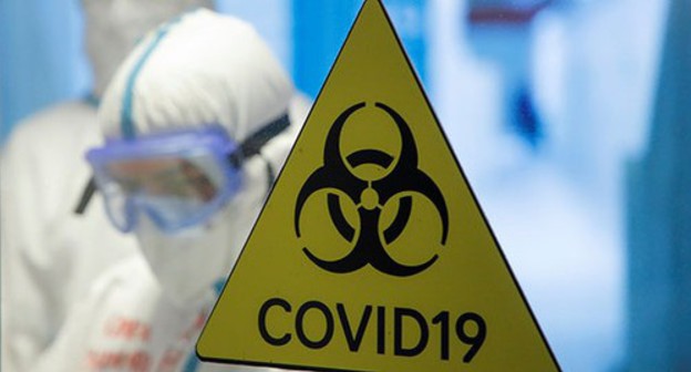 COVID-19 warning sign. Photo: REUTERS/Maxim Shemetov COVID-19 warning sign. Photo: REUTERS/Maxim Shemetov