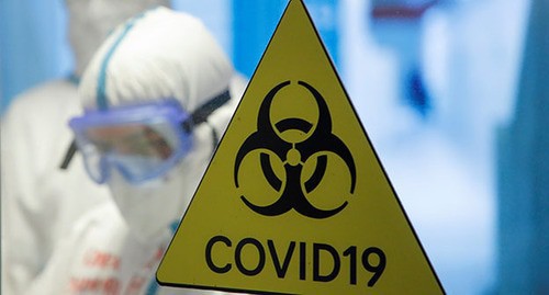 COVID-19 warning sign. Photo: REUTERS/Maxim Shemetov COVID-19 warning sign. Photo: REUTERS/Maxim Shemetov