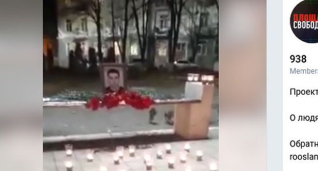 Flowers and candles in front of a photo of Inal Djabiev at the central square of Tskhinvali. Screenshot: https://t.me/s/freedom_square/259 Flowers and candles in front of a photo of Inal Djabiev at the central square of Tskhinvali. Screenshot: https://t.me/s/freedom_square/259