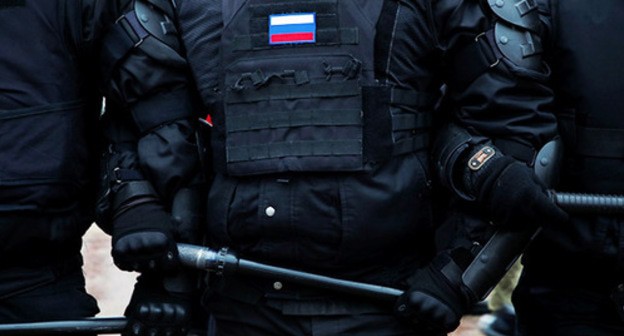 Law enforcers. Photo: REUTERS/Anton Vaganov Law enforcers. Photo: REUTERS/Anton Vaganov