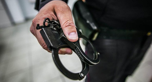 Handcuffs. Photo courtesy of Denis Yakovlev / Yugopolis Handcuffs. Photo courtesy of Denis Yakovlev / Yugopolis
