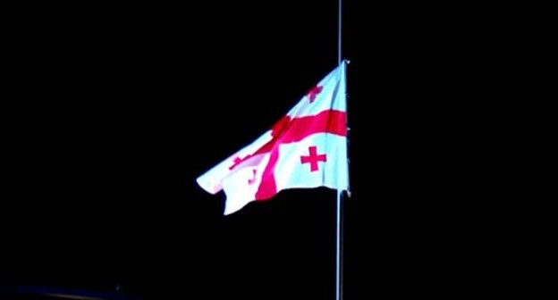 The flag of Georgia. Screenshot of the video https://1tv.ge/ru/news/na-gosudarstvennykh-zdanijakh-prispustili-flagi-gruzii-v-chest-pamjati-o-pogibshikh-v-avgustovskoj-vojne-video/ The flag of Georgia. Screenshot of the video https://1tv.ge/ru/news/na-gosudarstvennykh-zdanijakh-prispustili-flagi-gruzii-v-chest-pamjati-o-pogibshikh-v-avgustovskoj-vojne-video/