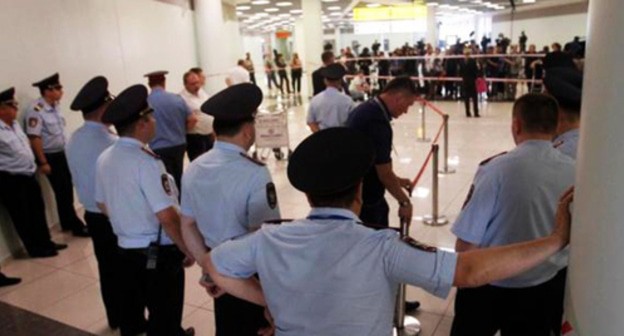 Policemen in the Sheremetyevo Airport. Photo courtesy of the press service of the HRC 'Memorial', http://memohrc.org Policemen in the Sheremetyevo Airport. Photo courtesy of the press service of the HRC 'Memorial', http://memohrc.org