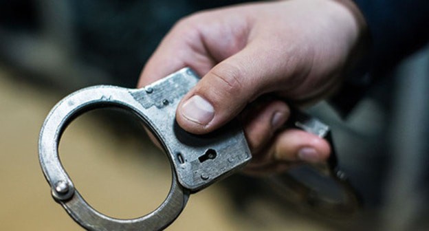 Handcuffs. Photo courtesy of Elena Sineok / Yuga.ru Handcuffs. Photo courtesy of Elena Sineok / Yuga.ru