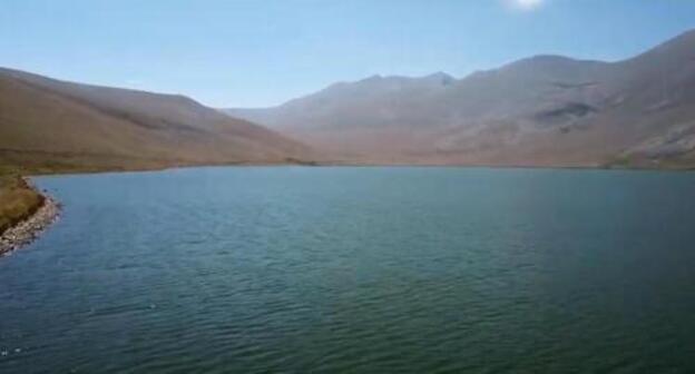 The Black Lake in the Syunik Region of Armenia. Screenshot of the video at the YouTube channel armen mograbyan https://www.youtube.com/watch?v=Qh45CC6K8_s The Black Lake in the Syunik Region of Armenia. Screenshot of the video at the YouTube channel armen mograbyan https://www.youtube.com/watch?v=Qh45CC6K8_s