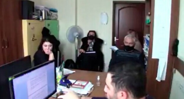 Interrogation of Zarina Dzagoeva (far left). Screenshot: http://youtu.be/D3LDhcQQAS8 Interrogation of Zarina Dzagoeva (far left). Screenshot: http://youtu.be/D3LDhcQQAS8