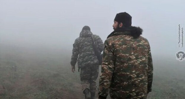 A priest and a soldier of the Armenian army. Photo by the press service of the country's Ministry of Defence A priest and a soldier of the Armenian army. Photo by the press service of the country's Ministry of Defence