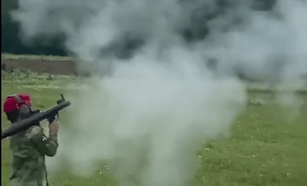 A child shooting from a grenade launcher. Screenshot of a video posted at the Lenta.ru website on 01.07.21, https://lenta.ru/news/2021/07/01/grntmt/ A child shooting from a grenade launcher. Screenshot of a video posted at the Lenta.ru website on 01.07.21, https://lenta.ru/news/2021/07/01/grntmt/