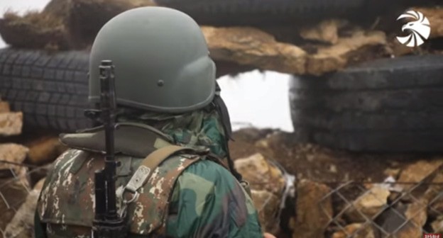 An Armenian soldier in the trenches. Screenshot of the video by ВООРУЖЕННЫЕ СИЛЫ MEDIA https://www.youtube.com/watch?v=FGXc0hWqj5M&t=1s An Armenian soldier in the trenches. Screenshot of the video by ВООРУЖЕННЫЕ СИЛЫ MEDIA https://www.youtube.com/watch?v=FGXc0hWqj5M&t=1s