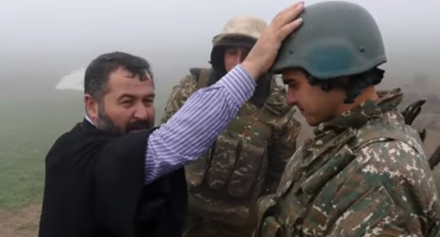 The priest blessed Armenian soldiers in the trenches. Screenshot of the video posted on YouTube ВООРУЖЕННЫЕ СИЛЫ MEDIA https://www.youtube.com/watch?v=FGXc0hWqj5M&t=1s The priest blessed Armenian soldiers in the trenches. Screenshot of the video posted on YouTube ВООРУЖЕННЫЕ СИЛЫ MEDIA https://www.youtube.com/watch?v=FGXc0hWqj5M&t=1s