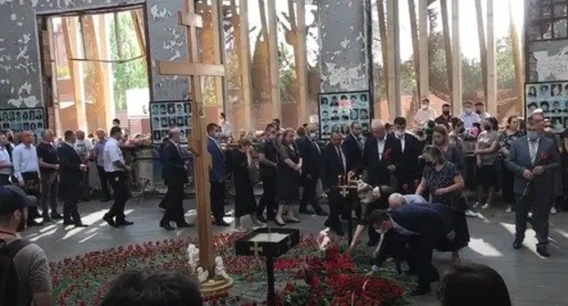 People laying flowers at the Beslan school, which was seized by terrorists 17 years ago. Screenshot from video posted by News Time: http://www.youtube.com/watch?v=8d3og_2uhis People laying flowers at the Beslan school, which was seized by terrorists 17 years ago. Screenshot from video posted by News Time: http://www.youtube.com/watch?v=8d3og_2uhis