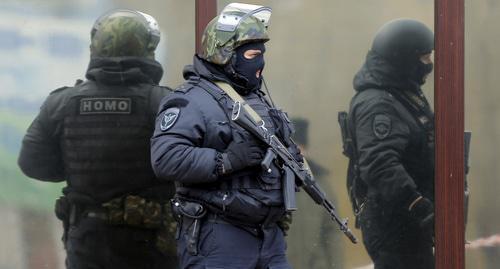 Law enforcers. Photo: REUTERS/Maxim Shemetov Law enforcers. Photo: REUTERS/Maxim Shemetov