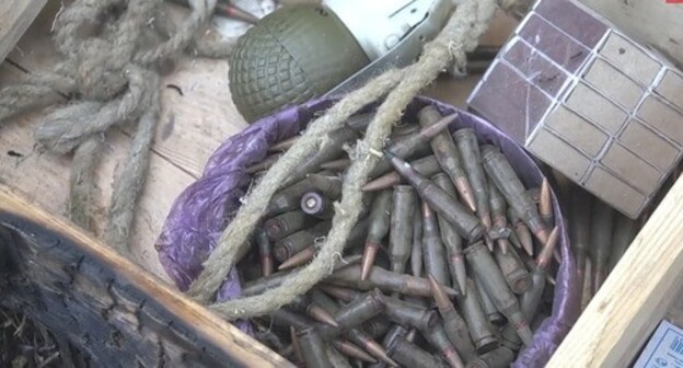 Weapons found by the law enforcers at the shootout venue in a forest near the village of Talgi. Screenshot of the video by the Russian National Antiterrorist Committee (NAC) https://www.youtube.com/watch?v=6YJ01BOmZCY Weapons found by the law enforcers at the shootout venue in a forest near the village of Talgi. Screenshot of the video by the Russian National Antiterrorist Committee (NAC) https://www.youtube.com/watch?v=6YJ01BOmZCY