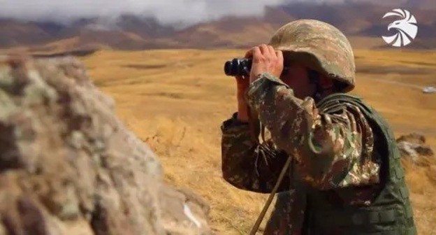 An Armenian soldier at a combat post. Screenshot of video posted by the Ministry of Defence of Armenia, http://mil.am/hy/news/9921 An Armenian soldier at a combat post. Screenshot of video posted by the Ministry of Defence of Armenia, http://mil.am/hy/news/9921