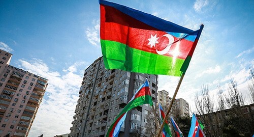 The flag of Azerbaijan at a protest action. Photo by Aziz Karimov for the "Caucasian Knot" The flag of Azerbaijan at a protest action. Photo by Aziz Karimov for the "Caucasian Knot"