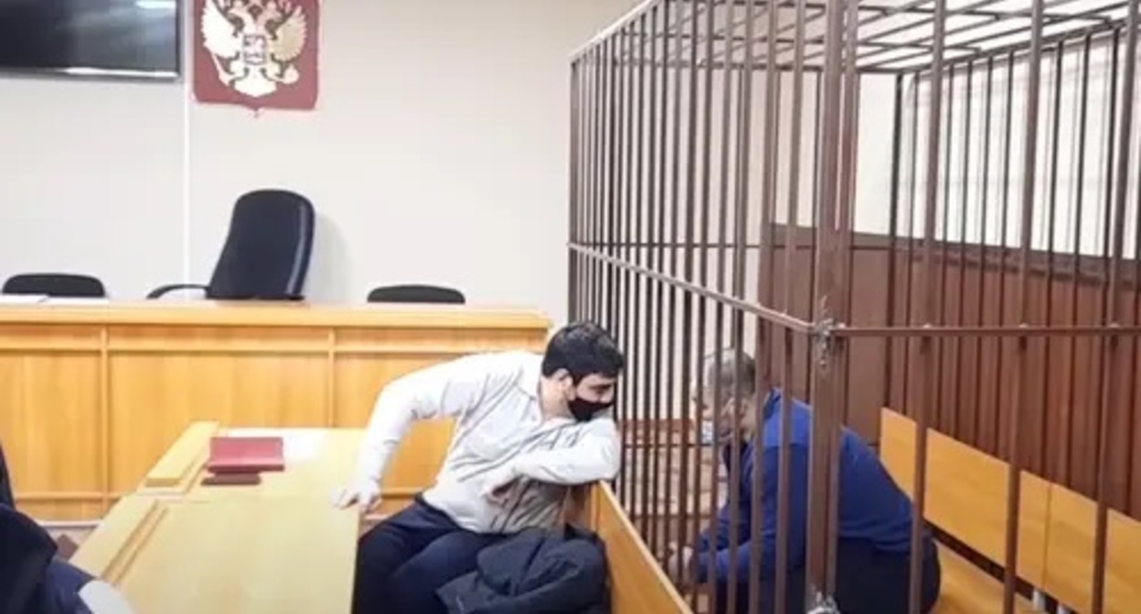 Defendant at a session of the Sovetsky District Court of Makhachkala in the case of the murder of the former head of the Novokuli village of the Novolaksky District, Abakar Kaplanov, and a lawyer. Screenshot of video posted by the Caucasian Knot https://www.youtube.com/watch?v=TaxYwlSWAC8 Defendant at a session of the Sovetsky District Court of Makhachkala in the case of the murder of the former head of the Novokuli village of the Novolaksky District, Abakar Kaplanov, and a lawyer. Screenshot of video posted by the Caucasian Knot https://www.youtube.com/watch?v=TaxYwlSWAC8