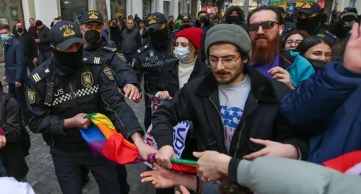 Policemen take away a rainbow flag from a participant of a rally in Baku, March 2022. Photo by Aziz Karimov for the Caucasian Knot Policemen take away a rainbow flag from a participant of a rally in Baku, March 2022. Photo by Aziz Karimov for the Caucasian Knot