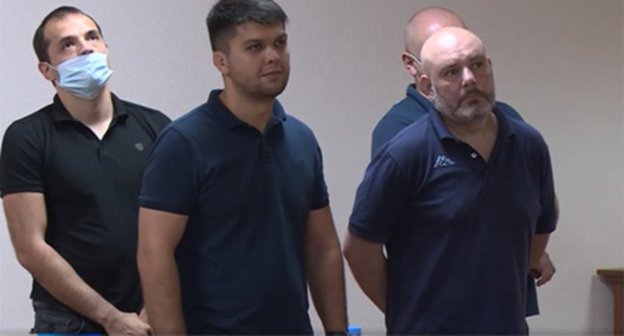 The policemen convicted in the case on Tskaev’s death in the courtroom. Screenshot of the video by the Russian TV channel https://alaniatv.ru/verhovnyj-sud-rso-a-smyagchil-prigovory-shesti-osuzhdyonnym-po-delu-tskaeva/ The policemen convicted in the case on Tskaev’s death in the courtroom. Screenshot of the video by the Russian TV channel https://alaniatv.ru/verhovnyj-sud-rso-a-smyagchil-prigovory-shesti-osuzhdyonnym-po-delu-tskaeva/