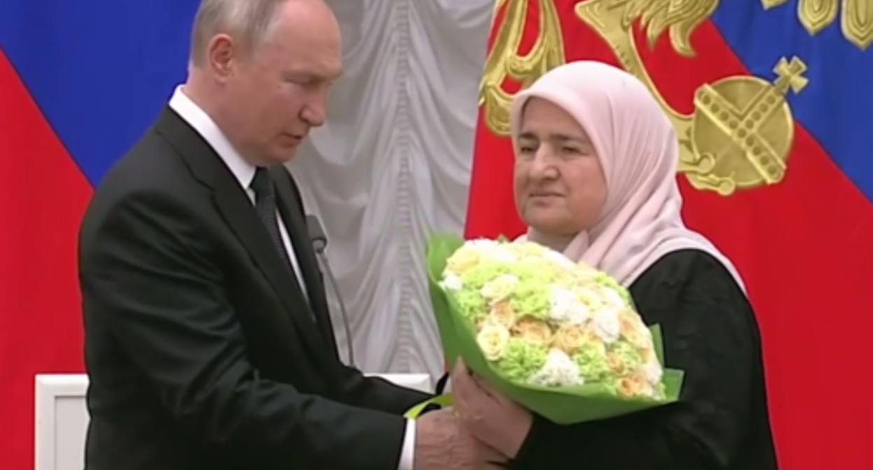Vladimir Putin and Aimani Kadyrova. Screenshot of the video posted on Ramzan Kadyrov's Telegram channel on August 2, 2023 https://t.me/RKadyrov_95/3794 Vladimir Putin and Aimani Kadyrova. Screenshot of the video posted on Ramzan Kadyrov's Telegram channel on August 2, 2023 https://t.me/RKadyrov_95/3794