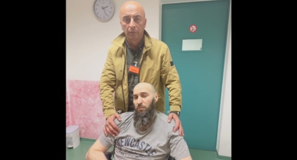 Lachin Mamishov paid a visit to Ali Bataev in a deportation centre. Screenshot of the video by the Marka Film Production https://www.youtube.com/watch?v=Z-xK8K6sCEc Lachin Mamishov paid a visit to Ali Bataev in a deportation centre. Screenshot of the video by the Marka Film Production https://www.youtube.com/watch?v=Z-xK8K6sCEc