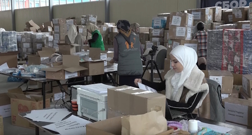 Residents of Ingushetia help packing the humanitarian aid for Palestinians, screenshot of the video from the ING DIARY channel https://www.youtube.com/watch?v=3WqaaM-HiOk Residents of Ingushetia help packing the humanitarian aid for Palestinians, screenshot of the video from the ING DIARY channel https://www.youtube.com/watch?v=3WqaaM-HiOk