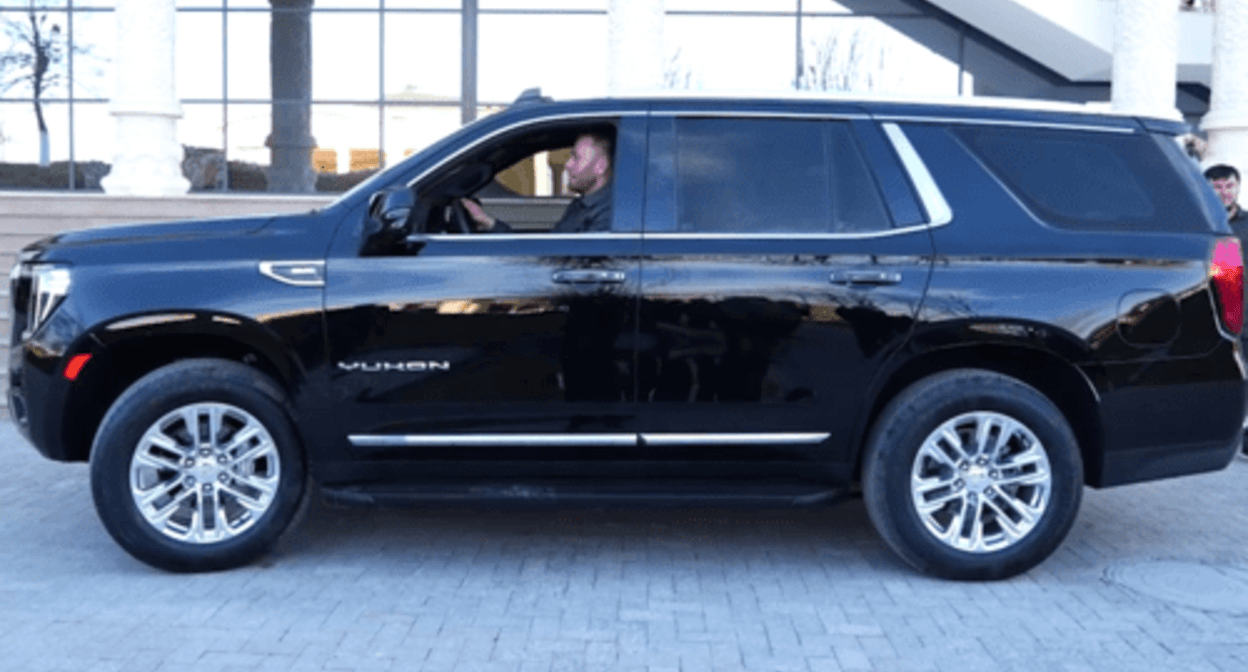 Murad Bichuev, a coach, in his new car. Screenshot of a video posted on Ramzan Kadyrov's Telegram channel on February 10, 2024, https://t.me/RKadyrov_95/4462 Murad Bichuev, a coach, in his new car. Screenshot of a video posted on Ramzan Kadyrov's Telegram channel on February 10, 2024, https://t.me/RKadyrov_95/4462