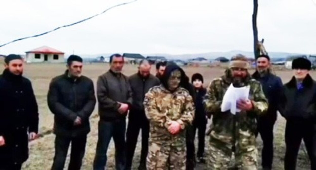 Murat Esmurziev (in the center) records a video appeal to Putin. Screenshot of a video published by the "Fortanga" https://t.me/fortangaorg/17448 Murat Esmurziev (in the center) records a video appeal to Putin. Screenshot of a video published by the "Fortanga" https://t.me/fortangaorg/17448