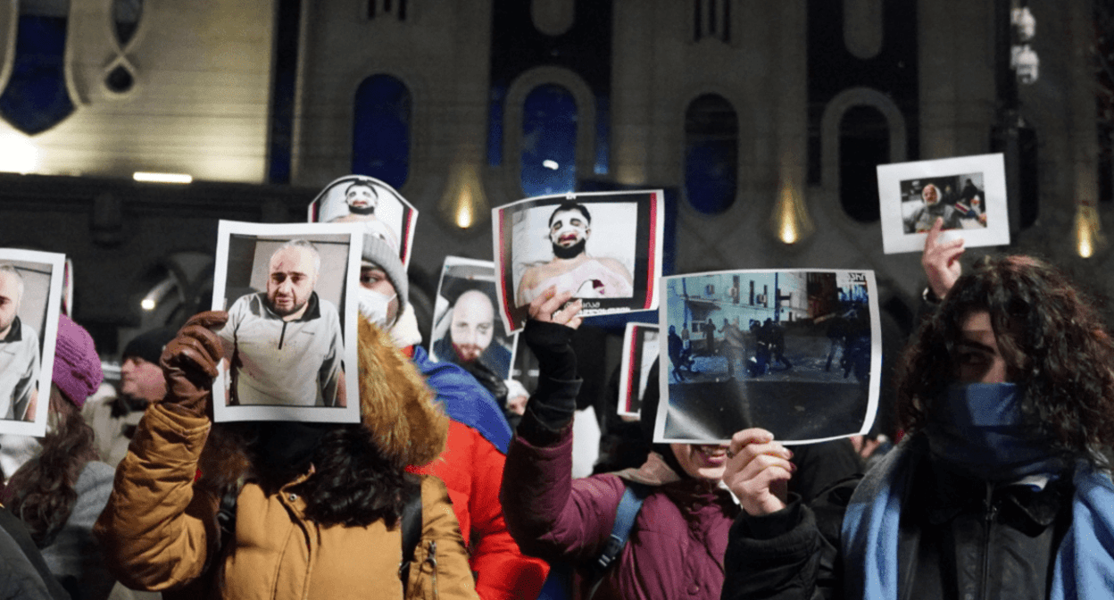 Protesters at the Georgian Parliament with photos of people beaten during the dispersal of protests. Screenshot of a photo posted on the Facebook page (the activities of the Meta Company, owning Facebook, are banned in Russia) of Publika on December 14, 2024 https://www.facebook.com/photo?fbid=1323468535719360&set=pcb.1323472962385584 Protesters at the Georgian Parliament with photos of people beaten during the dispersal of protests. Screenshot of a photo posted on the Facebook page (the activities of the Meta Company, owning Facebook, are banned in Russia) of Publika on December 14, 2024 https://www.facebook.com/photo?fbid=1323468535719360&set=pcb.1323472962385584