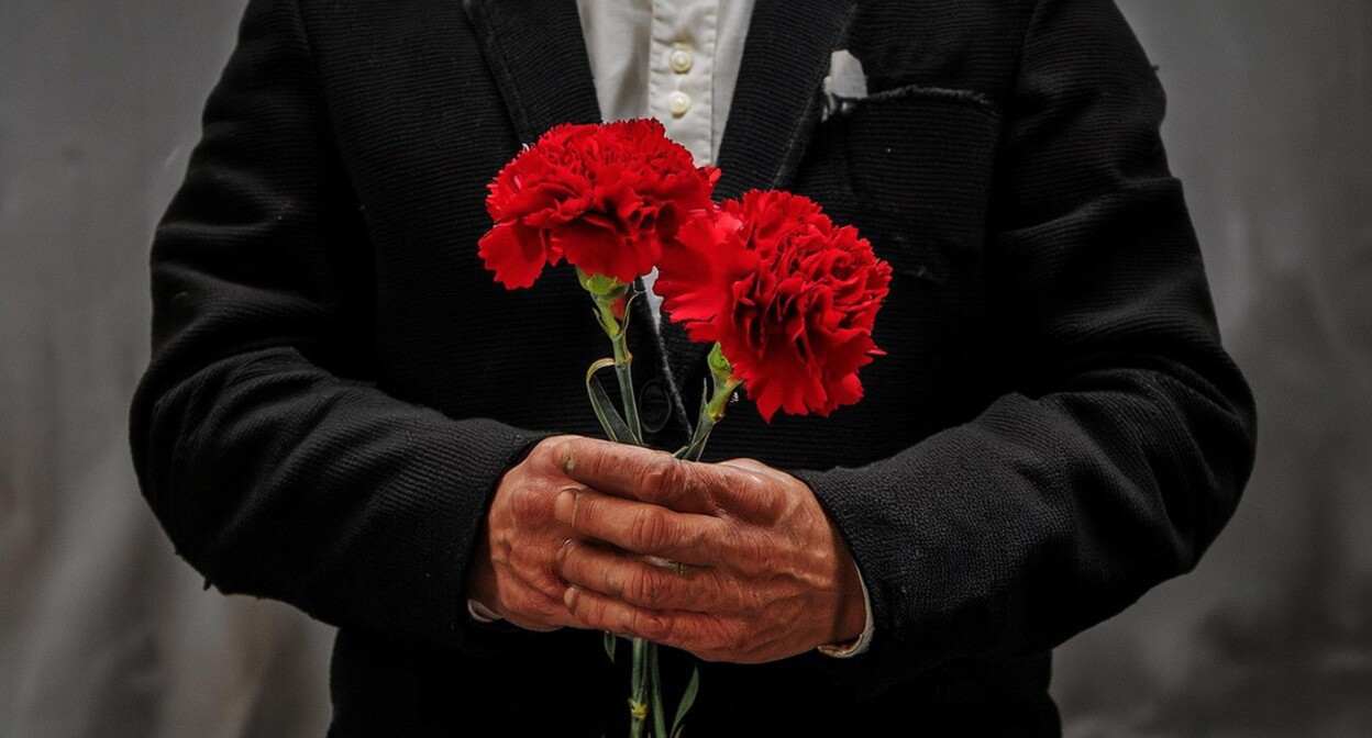 A man with carnations. Picture made in Photoshop by the "Caucasian Knot" A man with carnations. Picture made in Photoshop by the "Caucasian Knot"