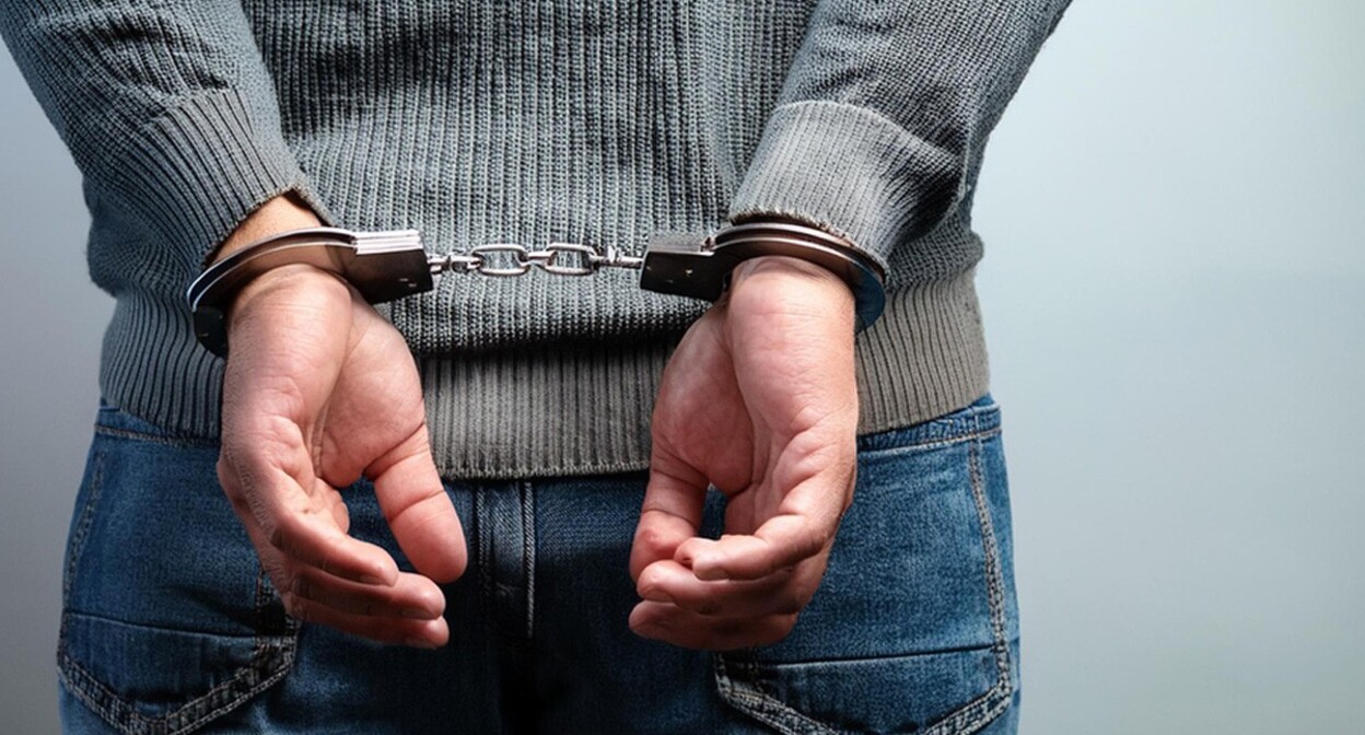 A man in handcuffs. Picture made in Photoshop by the "Caucasian Knot" A man in handcuffs. Picture made in Photoshop by the "Caucasian Knot"