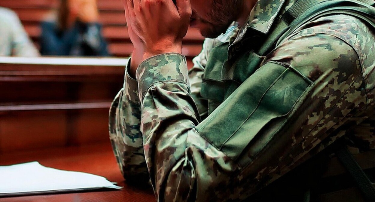 A military serviceman in a court. Picture made in Photoshop by the "Caucasian Knot" A military serviceman in a court. Picture made in Photoshop by the "Caucasian Knot"