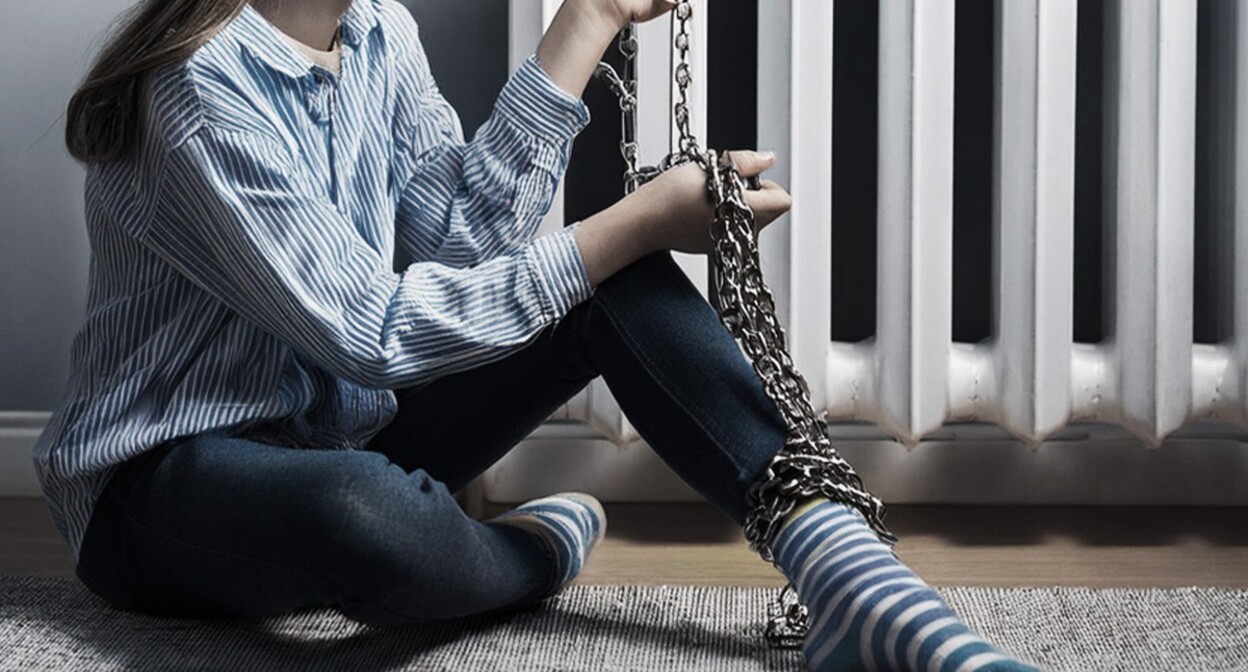 A girl chained to a heat radiator. Picture made in Photoshop by the "Caucasian Knot" A girl chained to a heat radiator. Picture made in Photoshop by the "Caucasian Knot"