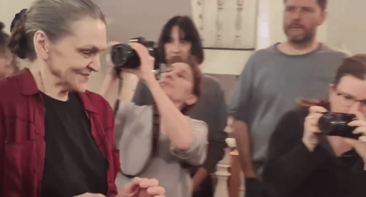 Nadezhda Kevorkova in handcuffs is lead to a courtroom. Screenshot of a video posted by the RusNews on March 12, 2025, https://t.me/rusnews/68047 Nadezhda Kevorkova in handcuffs is lead to a courtroom. Screenshot of a video posted by the RusNews on March 12, 2025, https://t.me/rusnews/68047