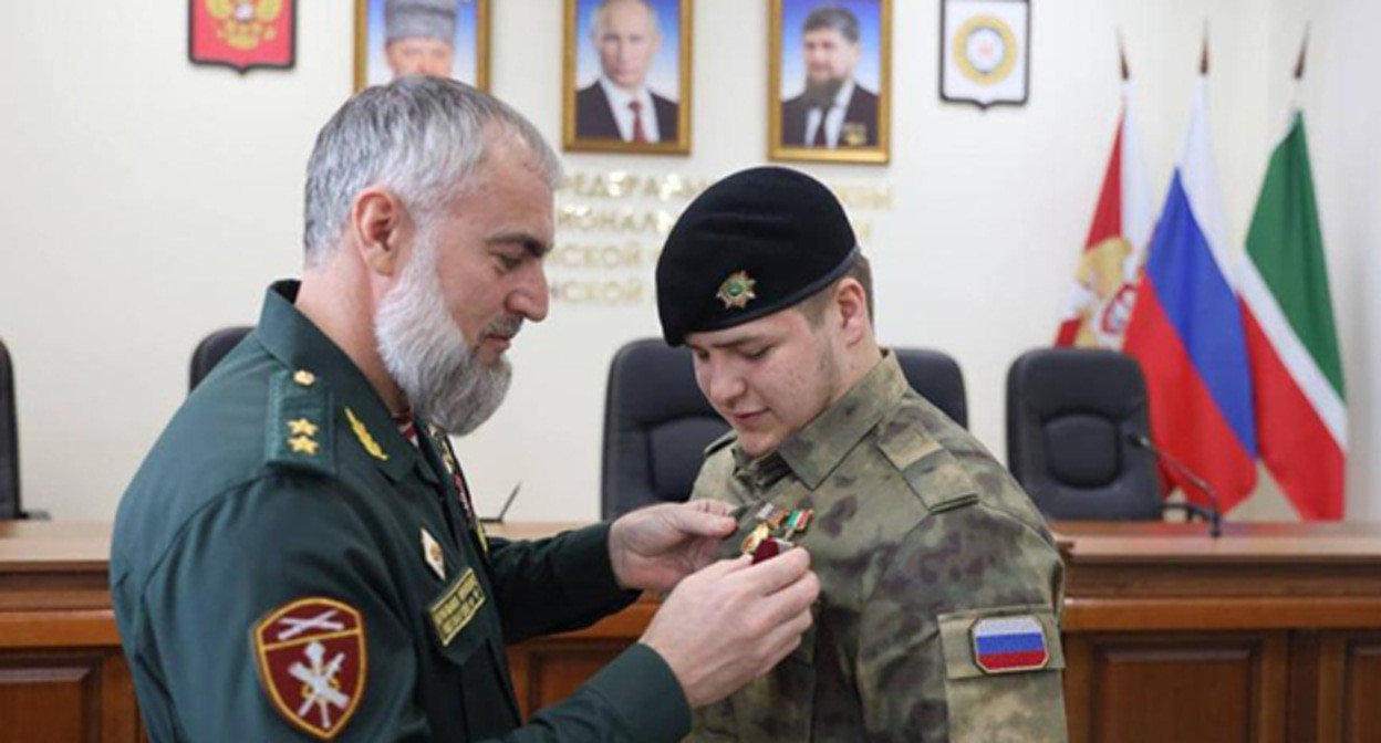 Award of Adam Kadyrov (right). March 27, 2025. Photo: https://www.grozny-inform.ru/news/politic/170122/ Award of Adam Kadyrov (right). March 27, 2025. Photo: https://www.grozny-inform.ru/news/politic/170122/