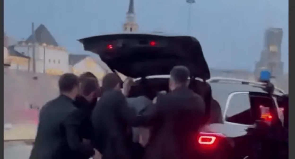 Chechen enforcers put Areg Shchepikhin in the trunk. Still image of Caucasian Knot video, https://www.youtube.com/shorts/lqkgd7MfIM8 Chechen enforcers put Areg Shchepikhin in the trunk. Still image of Caucasian Knot video, https://www.youtube.com/shorts/lqkgd7MfIM8