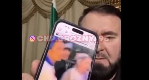 A frame of video of residents of Lyublino in Moscow. June 19, 2025.Mansur Soltaev shows a video on his cell phone. June 19, 2025 Screenshot of video https://t.me/chpgrozny_95/13893
