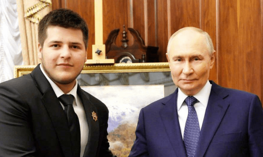 Adam Kadyrov (left) with Vladimir Putin. Screenshot of a photo from Ramzan Kadyrov's Telegram channel from 06/28/25, https://t.me/RKadyrov_95/5808 Adam Kadyrov (left) with Vladimir Putin. Screenshot of a photo from Ramzan Kadyrov's Telegram channel from 06/28/25, https://t.me/RKadyrov_95/5808