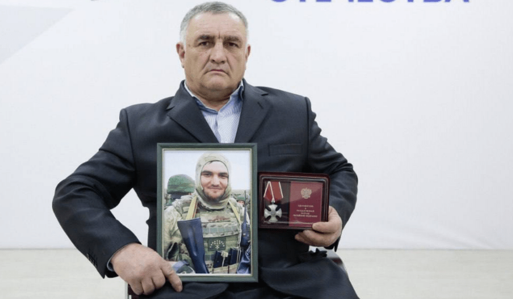 Ramazan Aripshev's father with his son's portrait and award. Screenshot of a photo from the Telegram channel of the Defenders of the Fatherland Foundation in Kabardino-Balkaria from 04.08.25, https://t.me/fond_ZO_kbr/7081. Ramazan Aripshev's father with his son's portrait and award. Screenshot of a photo from the Telegram channel of the Defenders of the Fatherland Foundation in Kabardino-Balkaria from 04.08.25, https://t.me/fond_ZO_kbr/7081.
