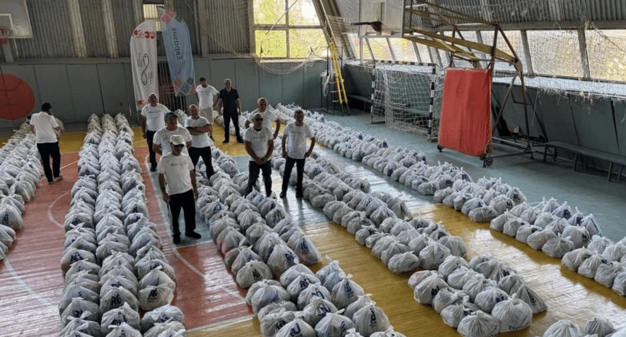 Packages with humanitarian aid. Screenshot of the photo by ANO "Eurasia" from 22.08.25, https://t.me/EurasiaNpo/6002