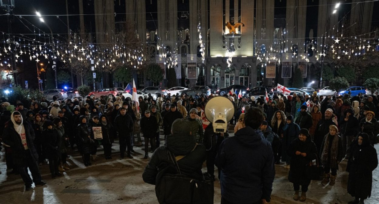 Protesters outside the Georgian Parliament. Screenshot from Publika photo from December 26, 2025, https://www.facebook.com/photo?fbid=1639520170780860&set=pcb.1639520224114188