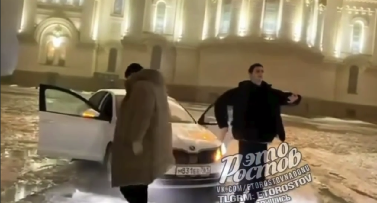 A still of three young people dancing near the cathedral. Photo: Donnews / Telegram channel