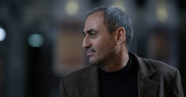 Afghan Sadigov. Screenshot of Publika photo? https://publika.ge/gamocema-qazetci-is-cnobit-afgan-sadigovi-ukve-baqoshi-imyofeba-da-is-azerbaijanul-mkhares-witeli-khidis-gamshweb-punqtze-gadasces/?fbclid=IwY2xjawQ_ZLlleHRuA2FlbQIxMQBicmlkETFDN1B6NjNaVDI1QkQybUVhc3J0YwZhcHBfaWQQMjIyMDM5MTc4ODIwMDg5MgABHokjAOfL9MhckwJeGXljSKt4gglmgJ3IQxWYY-lNxXiyxYWRgQaTZTrs2rr__aem_-FE-ZcLeJwk-OGorFvwqEQ