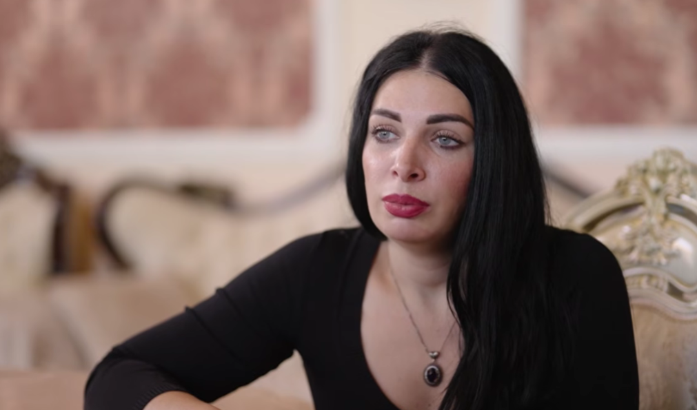 Maria Smelaya. Still frame from a video from the YouTube channel "Ostorozhno Media" from April 10, 2026, https://www.youtube.com/watch?v=pnjbgxxzYoY