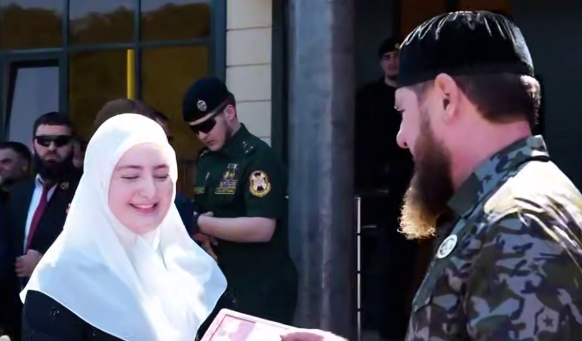Ramzan Kadyrov awards his daughter with a medal. Frame from the video dated 21.08.26, https://t.me/MDaudov_95/3175